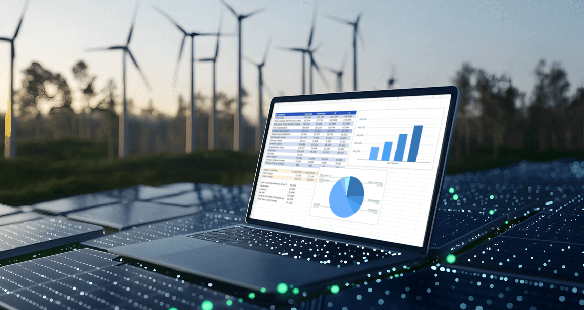 A computer with spreadsheets on the screen on top of solar panels with wind turbines in the background